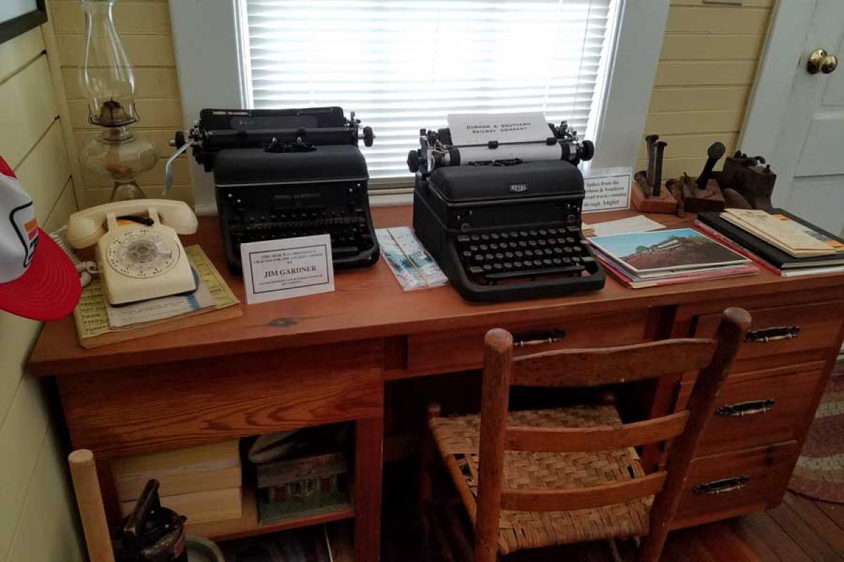 Angier Museum - Different Articles including Typewriters, Phone, and Desk