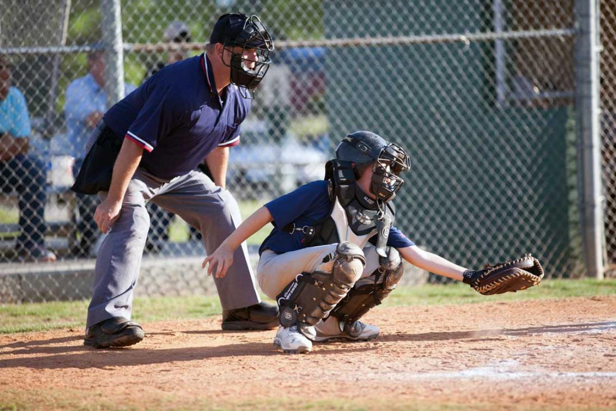 Catcher and Umpire on Baseball Field